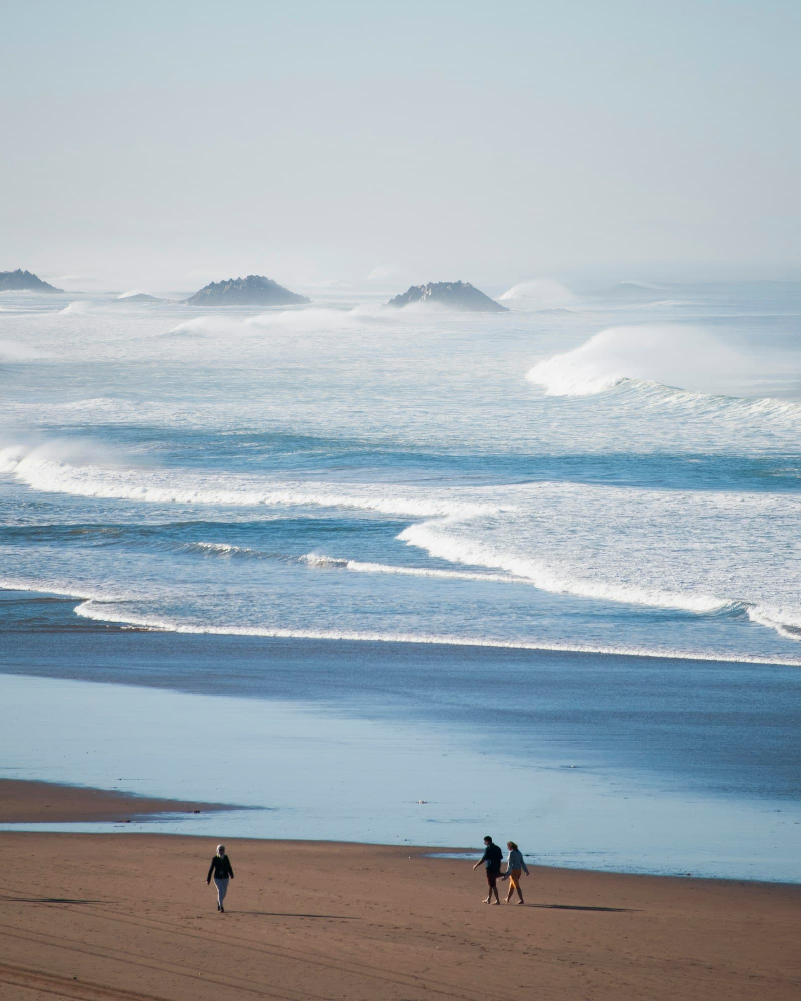 Waves rolling onto a wide sandy beach on the Atlantic coast