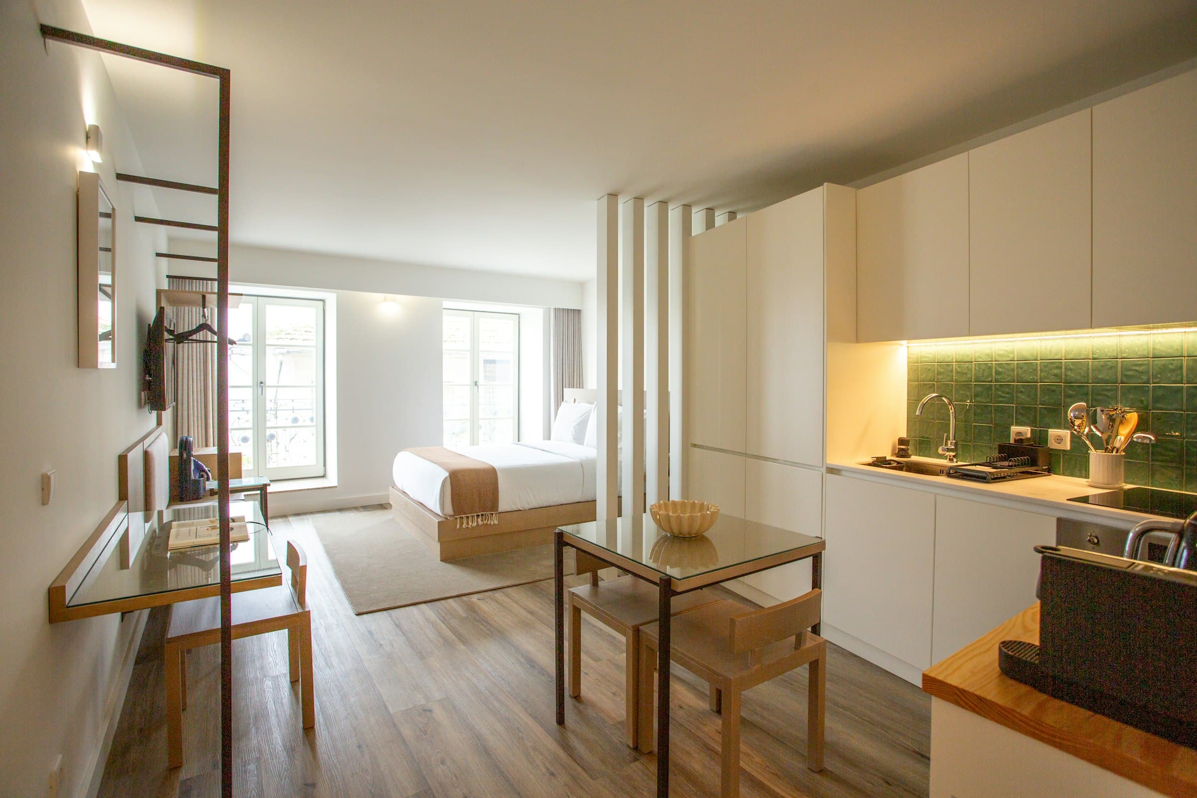 Open-plan apartment with a bed, a dining table and a kitchen (placeholder photo)